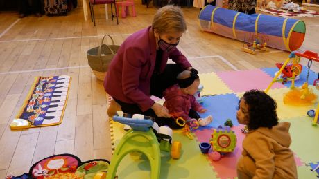 First Minister Nicola Sturgeon is playing with two children