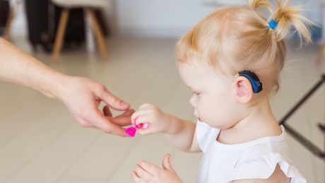 A child wearing a hearing aid